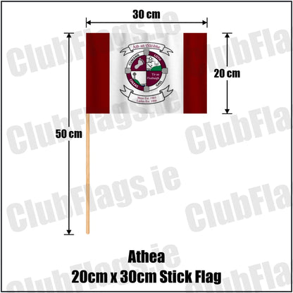 Athea 20cm x 30cm Stick Flag in maroon and white, featuring the club crest on realistic fabric with gentle vertical folds; County Limerick GAA. ClubFlags.ie.