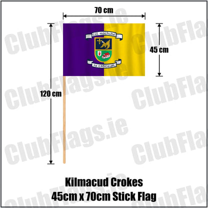 Kilmacud Crokes 45cm x 70cm Stick Flag in purple and gold, featuring the club crest on realistic fabric with gentle vertical folds; County Dublin GAA. ClubFlags.ie.