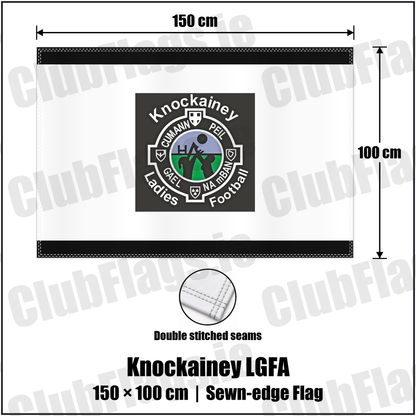 Knockainey LGFA 100cm x 150cm Flag (sewn on the edges), featuring the Knockainey Ladies Football crest on black and solid white fabric with gentle vertical folds; County Limerick. ClubFlags.ie.