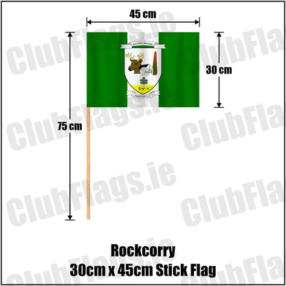 Rockcorry 30cm x 45cm Stick Flag in green and white, featuring the club crest on realistic fabric with gentle vertical folds; County Monaghan GAA. ClubFlags.ie.