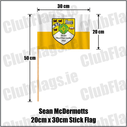 Sean McDermotts 20cm x 30cm Stick Flag in yellow and white, featuring the club crest on realistic fabric with gentle vertical folds; County Monaghan GAA. ClubFlags.ie.